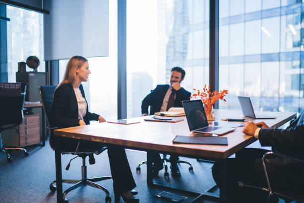 istock Successful professional experts in elegant wear discussing productive plan for work of employees during business meeting in conference room, concept of corporate brainstorming and collaboration 1440061893