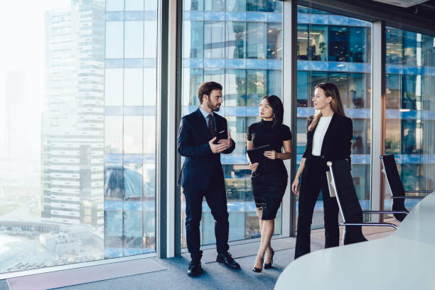 istock Prosperous professional team members in working group discussing ideas and having friendly conversation together,confident male manager meeting female business partners communicating about cooperation 1440062539