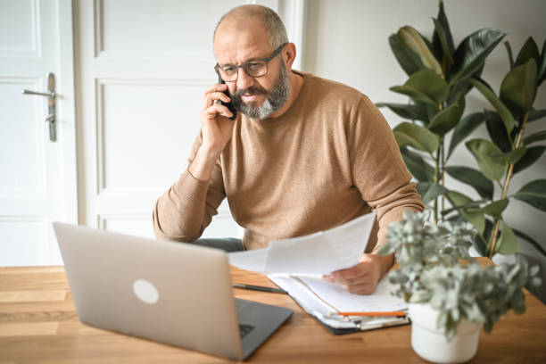 istock Mature man working from home 1440063983