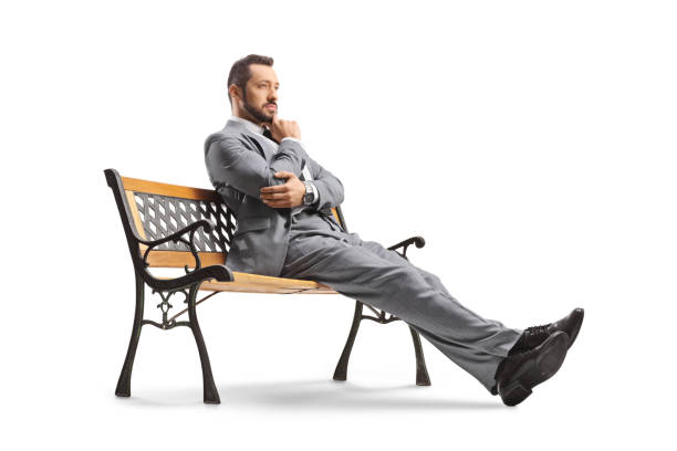 istock Pensive businessman sitting on a bench 1440064132