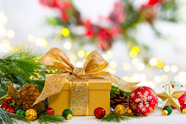 istock Christmas still life with Christmas gift boxes, festive decorations and fir branches. 1440065918