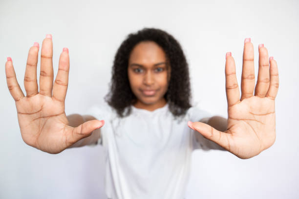 istock Close-up of female hands making stop gesture 1440066340