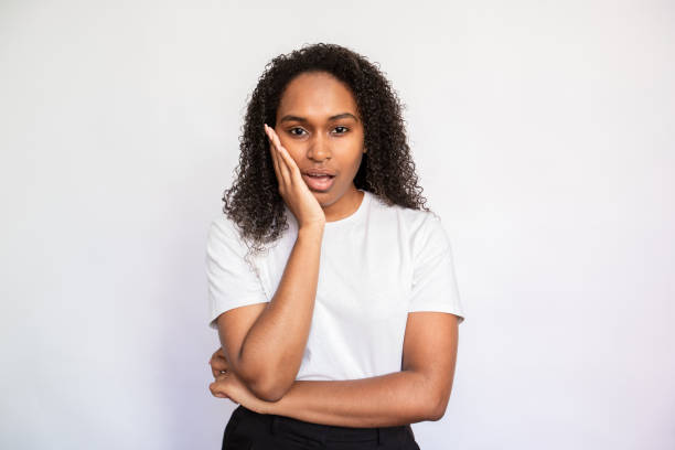 istock Portrait of distrustful young woman looking at camera 1440066424