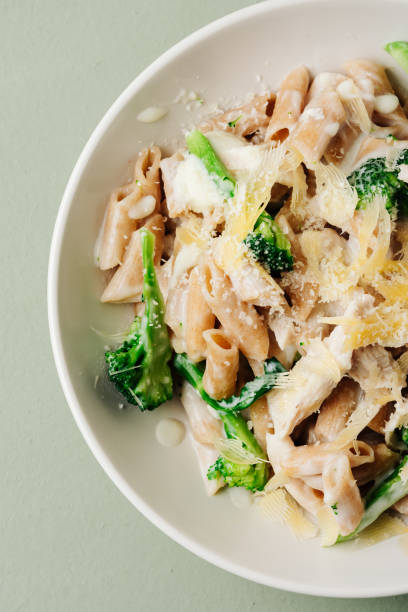 istock Whole grain penne pasta with chicken and green vegetables. 1440067295