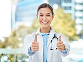 istock Thumbs up, smile and happy doctor, woman or physician with yes thumbsup for support. Portrait, goal or health approval hands, success for hospital worker or welcome motivation, winner or thank you. 1440068624