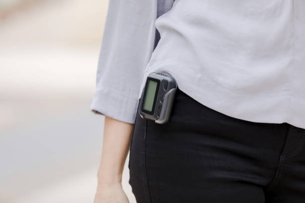 istock Unrecognizable woman with pager 1440070325