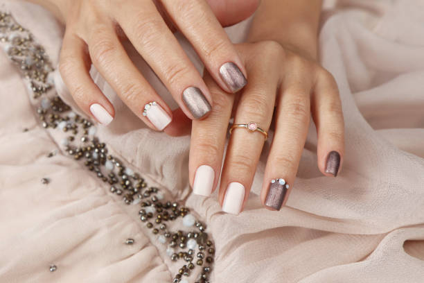 istock Milk chocolate manicure with rhinestones. 1440070449