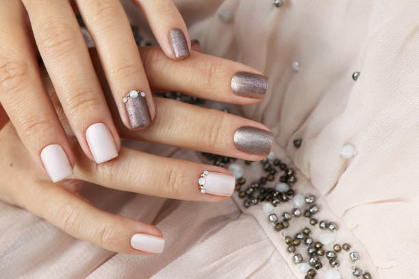 istock Milk chocolate manicure with rhinestones. 1440070451