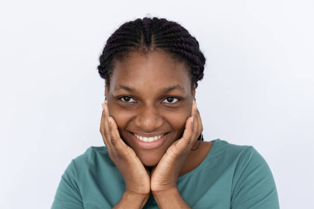 istock Happy woman touching face 1440072882