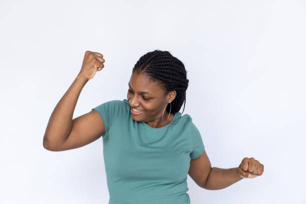 istock Victorious woman dancing 1440072896
