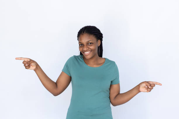 istock Happy woman pointing at opposite sides 1440072901