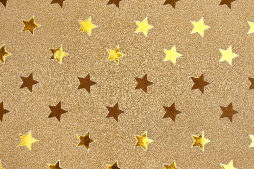 Gold background with glittering golden stars.