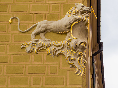 Close up of the Lion sculpture on a wall in Old Town Market, Square in Warsaw, Poland