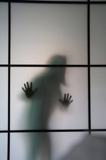 силуэт женщины за матовым стеклом - ghost women caucasian transparent стоковые фото и изображения