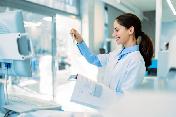 istock Female science intern analyzing DNA, RNA or blood samples for drug use results, disease and virus research in laboratory 1440081166