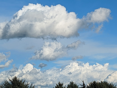 Large clouds drift over Surrey, British Columbia, in autumn.