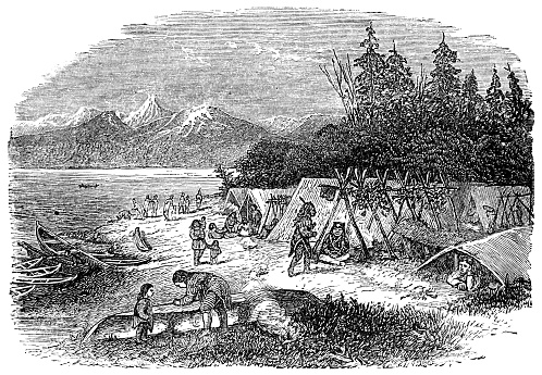 Native Alaskan camp by a river in Alaska, USA. Vintage etching circa 19th century.