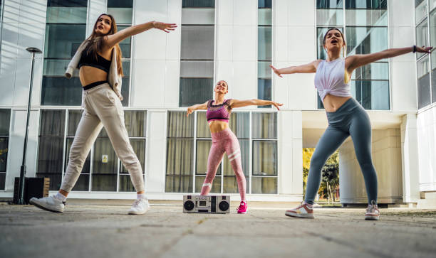 istock Group of young women dancing modern dance 1440090822