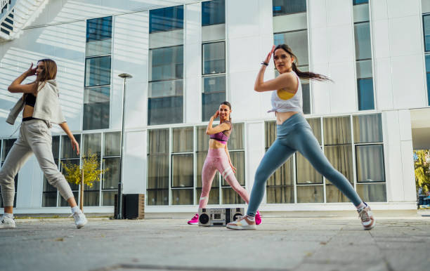 istock Group of young women dancing modern dance 1440091065