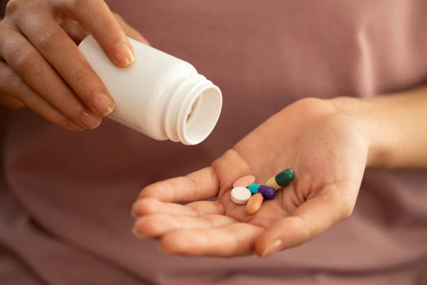 istock young woman getting medicine pill 1440092919