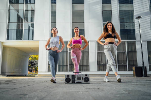 istock Young women dancing outdoors 1440093893