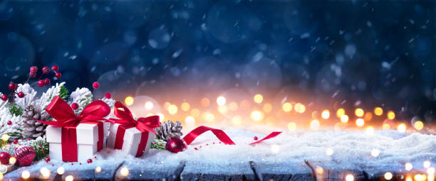 istock Gift Box On Snow In Winter Blue Background 1440096010