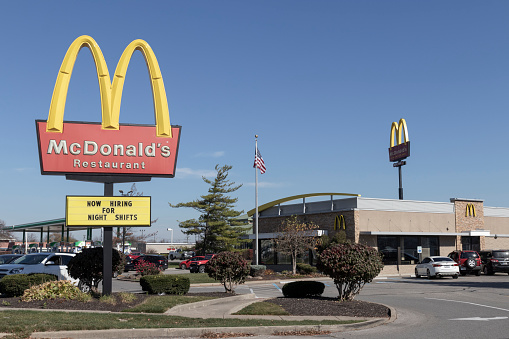 Brownsburg - Circa November 2022: McDonald's Restaurant. McDonald's is offering employees higher hourly wages, paid time off, and tuition payments.