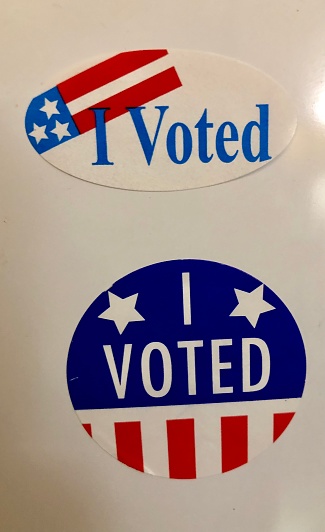 Two “I Voted” stickers proudly displayed on the refrigerator of an American Voter in a Hoboken, New Jersey apartment.