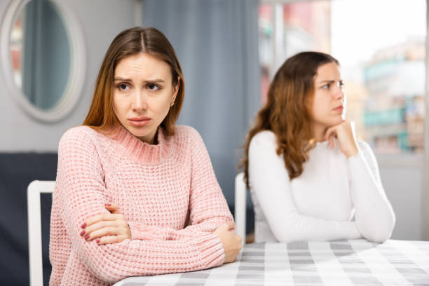 istock Annoyed stressed female couple sitting at home 1440098633
