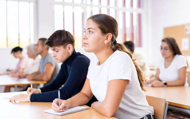 istock Young woman focused on lecture in university 1440098934