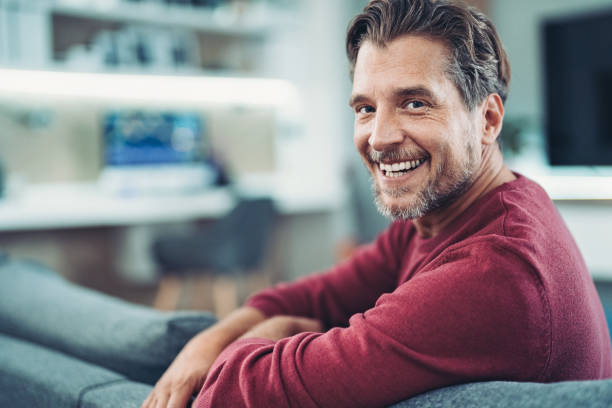 istock Happy mid-aged man at home 1440099686