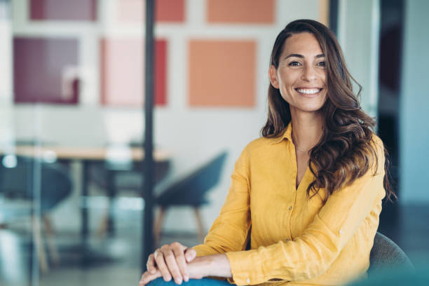 Smiling young businesswoman looking at the camera