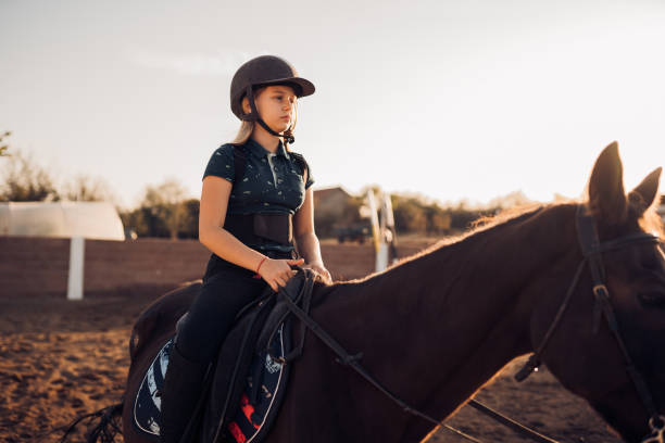 istock Girl riding a horse 1440100827