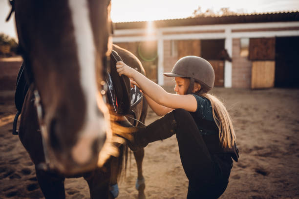 istock Girl riding a horse 1440101411