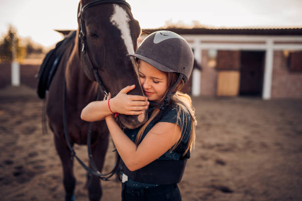 istock A girl hugs her horse 1440102954