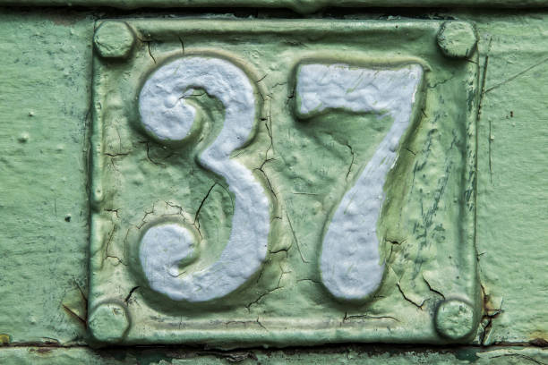 istock Old retro cast iron plate number 37 1440102975