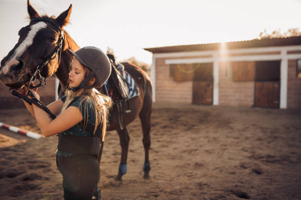 istock A girl hugs her horse 1440103587