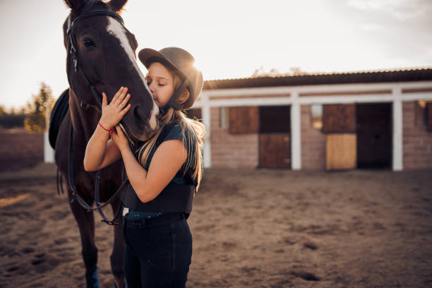 istock A girl hugs her horse 1440103591