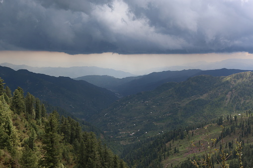 Gray clouds rainy weather over a velley and mountain layering lasdana bagh azad kashmir