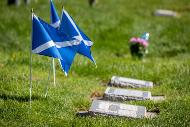 istock Scottish Flags Decorating Headstones at a Cemetery on US Memorial Day 1440106705