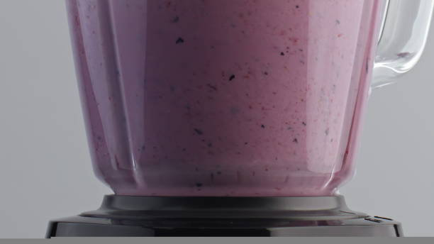 istock Closeup fruit blend mixing in blender super slow motion. Natural milkshake. 1440109897