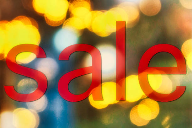 istock sale sign and christmas light at night 1440110757