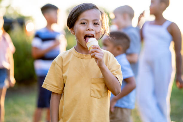 istock Kids eating ice cream 1440111497