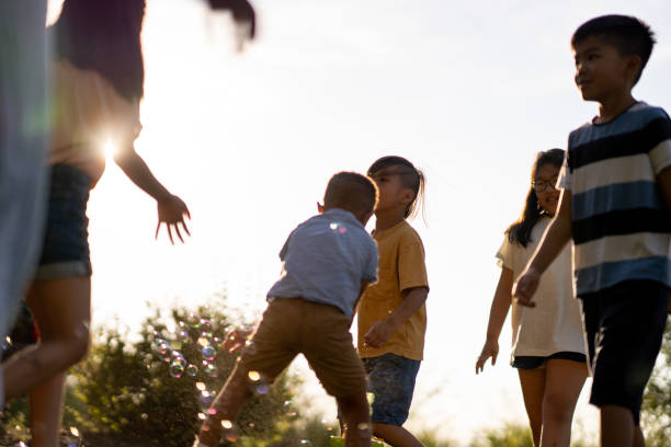 istock Kids frolicking on a summer evening 1440111501