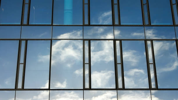 istock Modern office building facades with glass and reflecting sunlight in the windows. 1440115457
