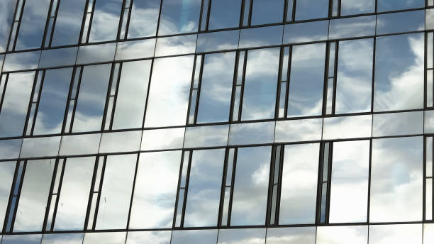 istock Modern office building facades with glass and reflecting sunlight in the windows. 1440115469