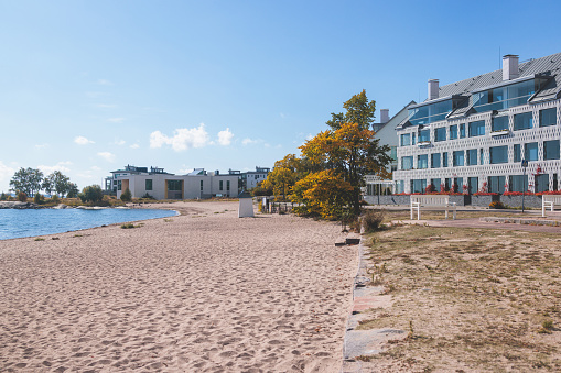 View of Hanko town coast, Hango, Finland, with beach and coastal waterfront, wooden houses and beach changing cabins, Uusimaa, Hanko Peninsula, Raseborg sub-region in a summer sunny day