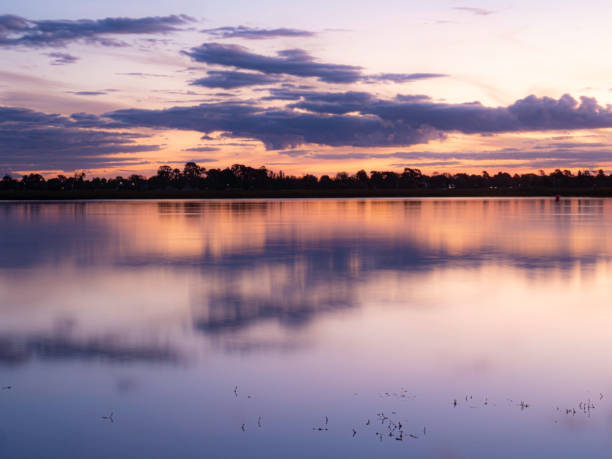 istock Beautiful sunset on lake 1440122923