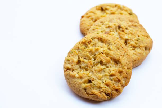 istock Pistachio and almond cookies on white background. 1440126282