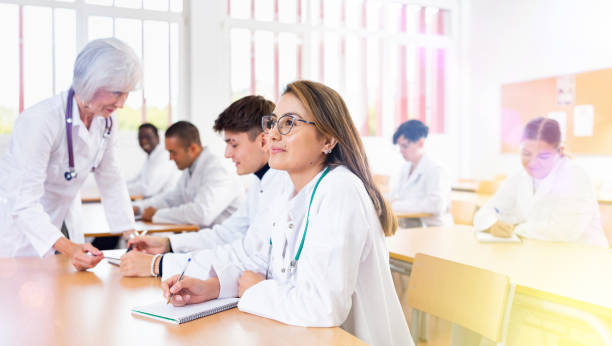istock Young woman medical student attending lecture in university 1440126521